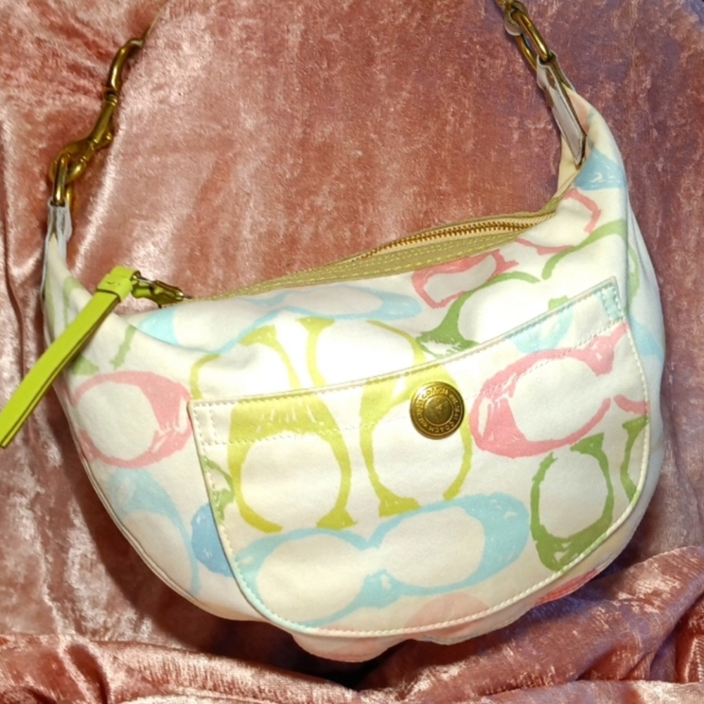 Coach Shoulder Bag with White Background and Pastel Colored C’s.  Green Trim.GUC